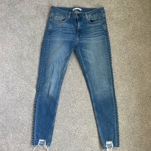 Skinny jeans with beaded detail down side